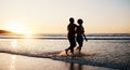 Beach sunset, sea water and silhouette couple walking, connect or enjoy romantic holiday in South Africa. Love, ocean Royalty Free Stock Photo
