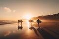 Beach at sunset, silhouette of young surfer people with boards on the beach at sunset