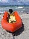 Beach: surf life-saving inflatable and swimmers Royalty Free Stock Photo