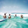 at the beach, surfers swiming in the sea and having fun in summer. Extreme sport and vacation concept. Father and Royalty Free Stock Photo