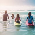 at the beach, surfers swiming in the sea and having fun in summer. Extreme sport and vacation concept. Father and Royalty Free Stock Photo