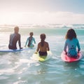 at the beach, surfers swiming in the sea and having fun in summer. Extreme sport and vacation concept. Father and Royalty Free Stock Photo