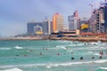 Beach and surfers in Tel Aviv, Israel