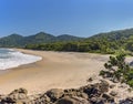 Beach surrounded by untouched forest and mountains in Bertioga