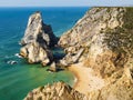 Amazing steep cliffs and stunning rocky formations dominating Ursa beach praia da ursa, Cabo da Roca cape, Portugal Royalty Free Stock Photo