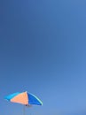 Beach tanning umbrella on a blue sky Royalty Free Stock Photo