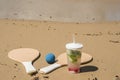 Beach tennis rackets in sand, caipirinha drink Royalty Free Stock Photo
