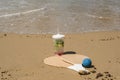 Beach tennis rackets in sand, caipirinha drink Royalty Free Stock Photo