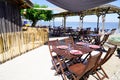 Beach terrace oyster restaurant in seaside with empty chairs and wood table on typical village of l`herbe in Cap Ferret France Royalty Free Stock Photo