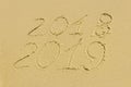 On the beach there is an inscription on the sand 2018 2019, rest Royalty Free Stock Photo