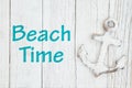 Beach time sign with anchor