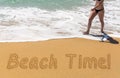 Beach Time written in sand with young woman Royalty Free Stock Photo