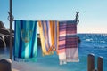 beach towels hung on anchors by the sea, generative Ai