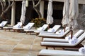 Beach towels at tropical resort and seats for laying in the sun at luxury hotel Royalty Free Stock Photo