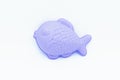 Beach toys: a fish shaped sand mold on a white background Royalty Free Stock Photo