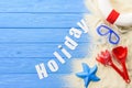 Beach toys and Holiday inscription on blue Royalty Free Stock Photo