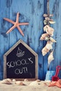 Beach toys, seashells, starfishes and text school holidays Royalty Free Stock Photo