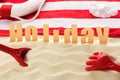 Beach toys and towel with Holiday inscription Royalty Free Stock Photo