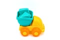 Beach toys: yellow plastic truck with various molds inside to make sand castles Royalty Free Stock Photo