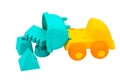 Beach toys: yellow plastic trucks unload various molds inside to make sand castles Royalty Free Stock Photo