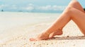 Beach travel concept. Legs on Tropical Sand Beach. Walking Female Feet. Closeup Royalty Free Stock Photo