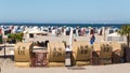 Beach of TravemÃÂ¼nde with wicker beach chairs and tourists. Royalty Free Stock Photo