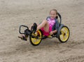 Beach trike with young child rider. Tricycle Bike Sandy Beach