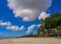 Beach on the tropical island. Clear blue water, sand and palm trees. Beautiful vacation spot, treatment and aquatics. Royalty Free Stock Photo