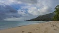 A beach on a tropical island. Footprints in the sand. Royalty Free Stock Photo