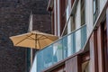 Beach umbrella on an apartment patio Royalty Free Stock Photo