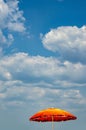 Beach umbrella, blue sky and clouds Royalty Free Stock Photo