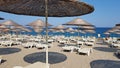 Beach straw umbrellas on the Mediterranean sea coast, Kemer, Turkey