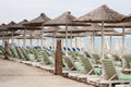 Beach umbrella and plastic deck chairs on the beach,Greek , pefkohori.
