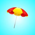 Beach umbrella Red and Yellow isolated on blue background Royalty Free Stock Photo