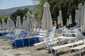 Beach umbrella and sun lounger chairs