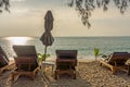 Beach umbrella and sunbath seats on Pak Weep beach
