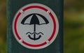 Beach umbrella to be secured sign