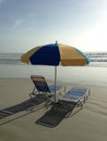 Beach Umbrella And Two Chairs/Beds On Daytona Beach, Florida.