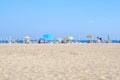 Beach umbrellas and deck chairs on sandy sea coast. Tourism and vacation in summer Royalty Free Stock Photo