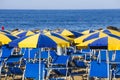 Beach with umbrellas at the first light of day in Italy