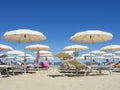 Beach umbrellas, gazebos and sun beds at Italian sandy beaches. Adriatic coast. Emilia Romagna, Itsly Royalty Free Stock Photo