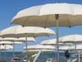 Beach umbrellas, gazebos and sun beds at Italian sandy beaches. Adriatic coast. Emilia Romagna, Itsly Royalty Free Stock Photo