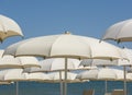 Beach umbrellas, gazebos and sun beds at Italian sandy beaches. Adriatic coast. Emilia Romagna region Royalty Free Stock Photo