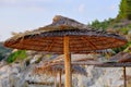 Beach umbrellas made of bamboo, on a island in Greece