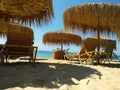Beach umbrellas at the stunning greek coast , Nea Iraklia area , Halkidiki Greece