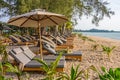Beach umbrellas and sunbath seats on Pak Weep beach