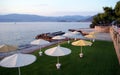 Beach umbrellas, view at sunset on Kalamaki Beach, Isthmia, Greece