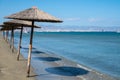 Beach unbrellas and chairs on sunny sandy beach Lady`s mile in Akritori, Cyprus