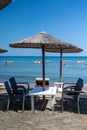 Beach unbrellas and chairs on sunny sandy beach Lady`s mile in Akritori, Cyprus