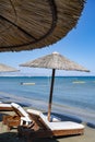 Beach unbrellas and chairs on sunny sandy beach Lady`s mile in Akritori, Cyprus